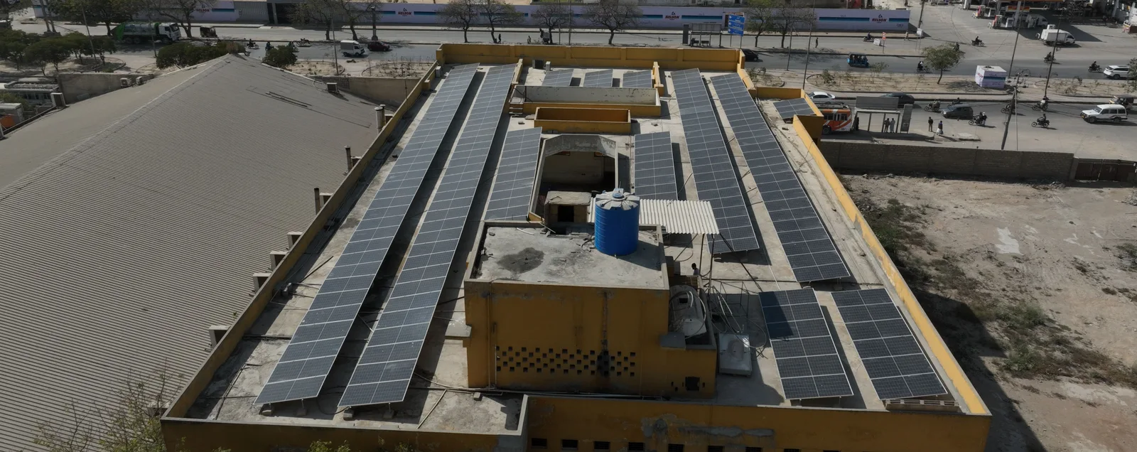 Solar panels fill the foreground of a rooftop photographed in the NAT Solar Shoot