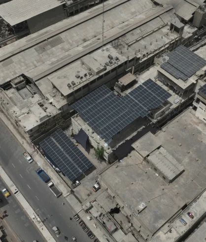 Aerial view of solar panels across the Ahmed Textile factory roof