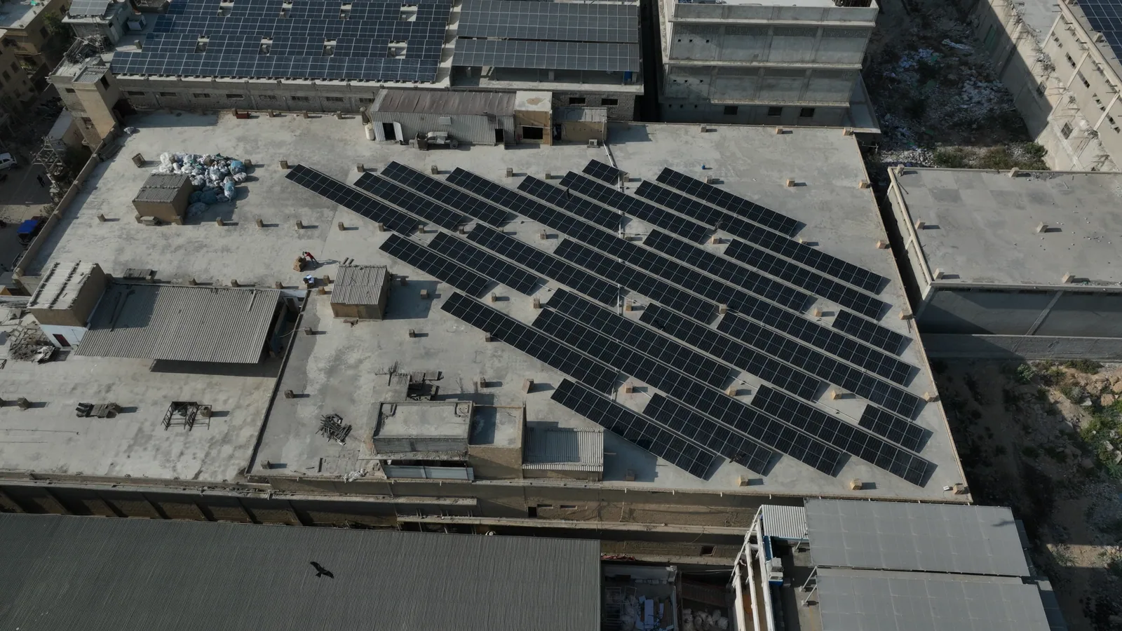 Solar arrays across the Habitt rooftop, viewed from above